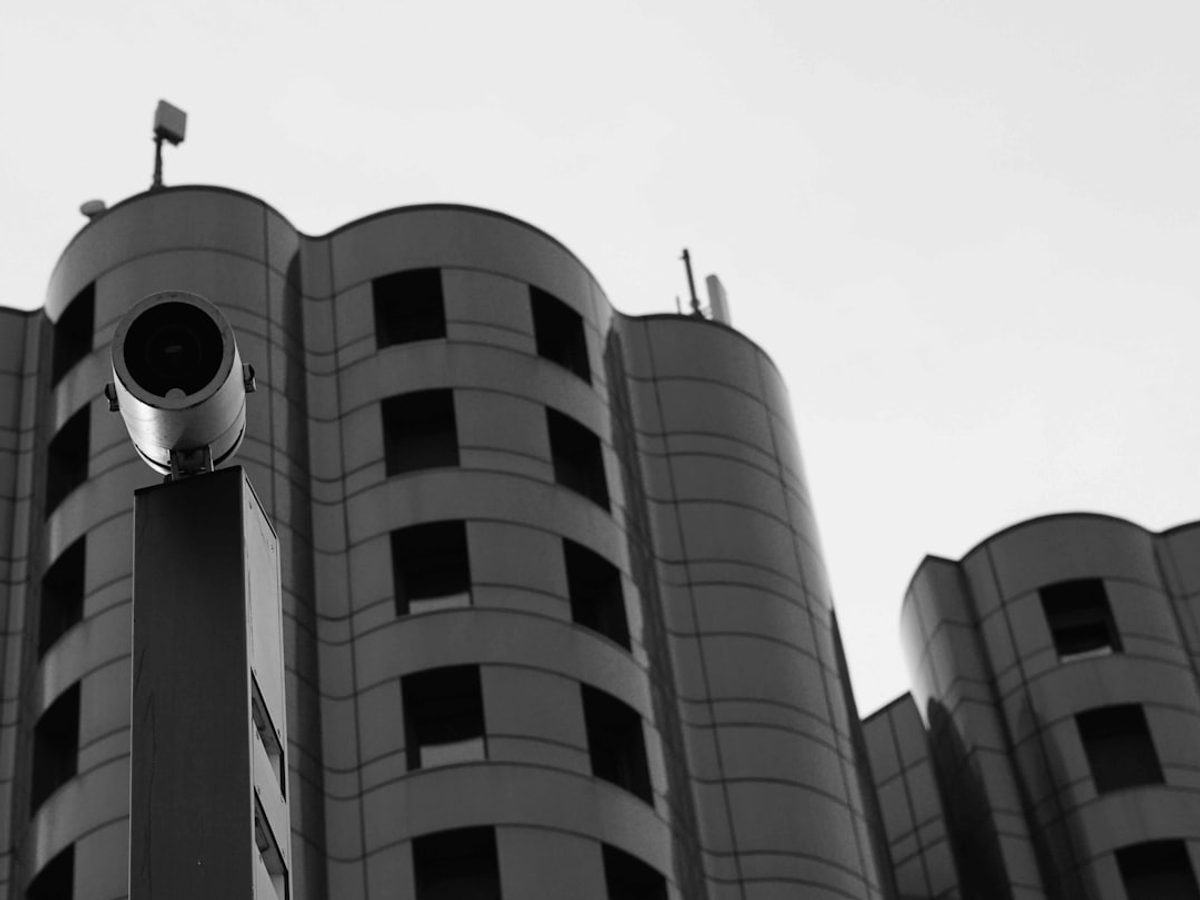 Security system technician inspecting CCTV equipment